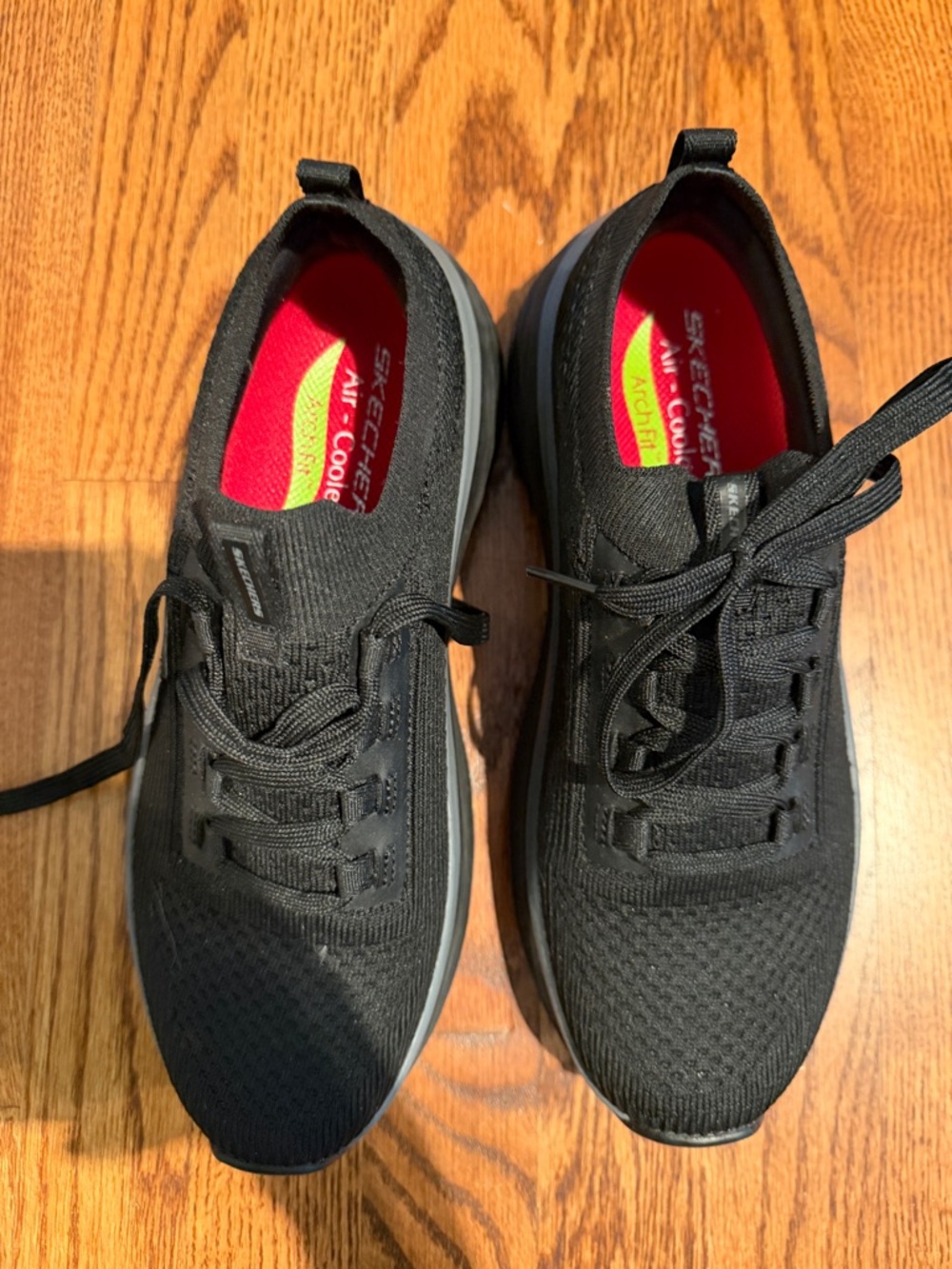 Skechers women’s  Black Knit Slip-On Athletic Sneakers with Red Insoles